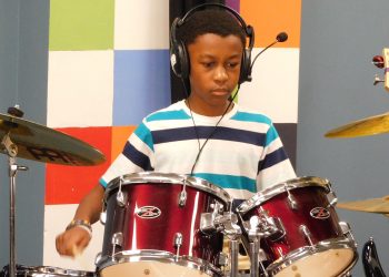 Client taking drum lessons at A Child Song