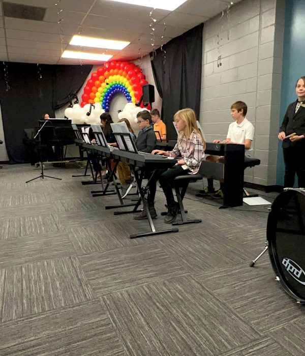 Ensemble of A Child's Song students perform at seasonal recital